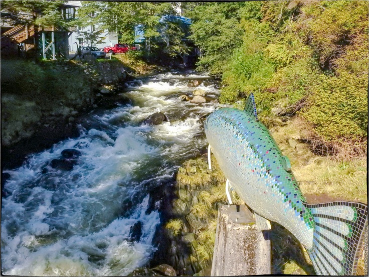 The statue pointing the way to the fish ladder in Ketchikan Creek