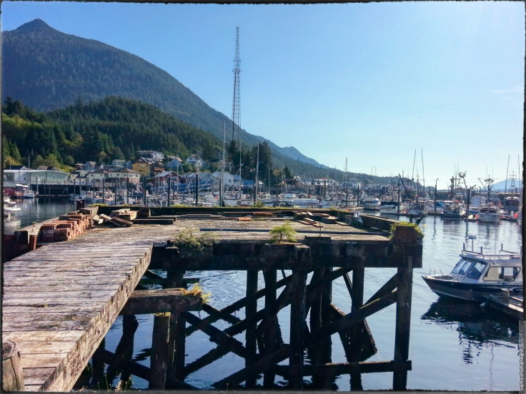 A photo of boats in the Ketchikan marina and a small boardwalk