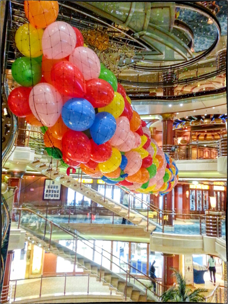 balloon net suspended from cruise ship's atrium ceiling